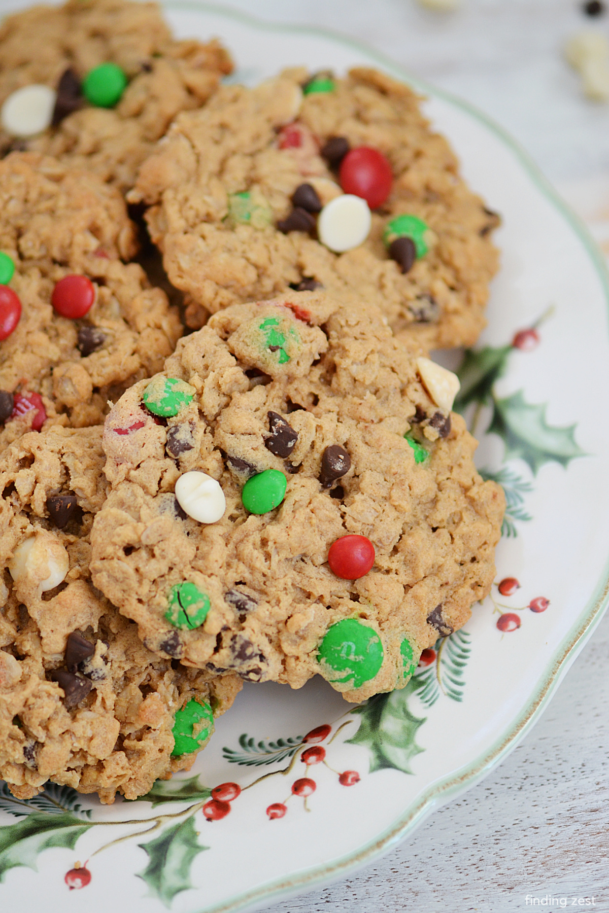 Christmas Monster cookies are a wonderful way to to celebrate the holiday season! Loaded with festive red and green M&Ms, creamy peanut butter, rolled oats, white chocolate chips and mini chocolate chips, they are a chewy and delicious Christmas cookie! Naturally gluten-free, this recipe is perfect for cookie swaps, gift giving or for Santa.