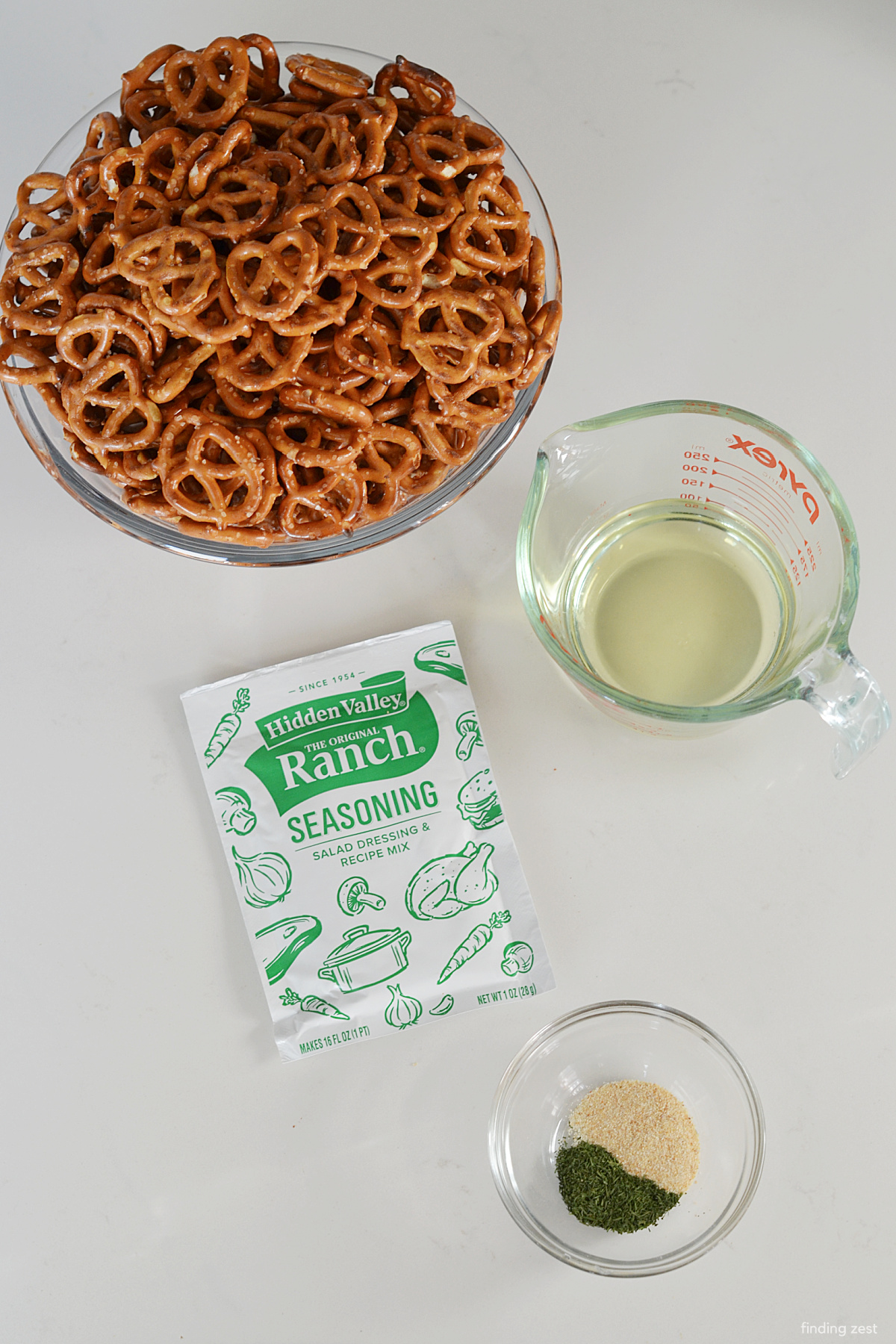 Ingredients to make ranch pretzels including pretzels, Hidden Valley Ranch seasoning, oil, garlic powder and dill weed.