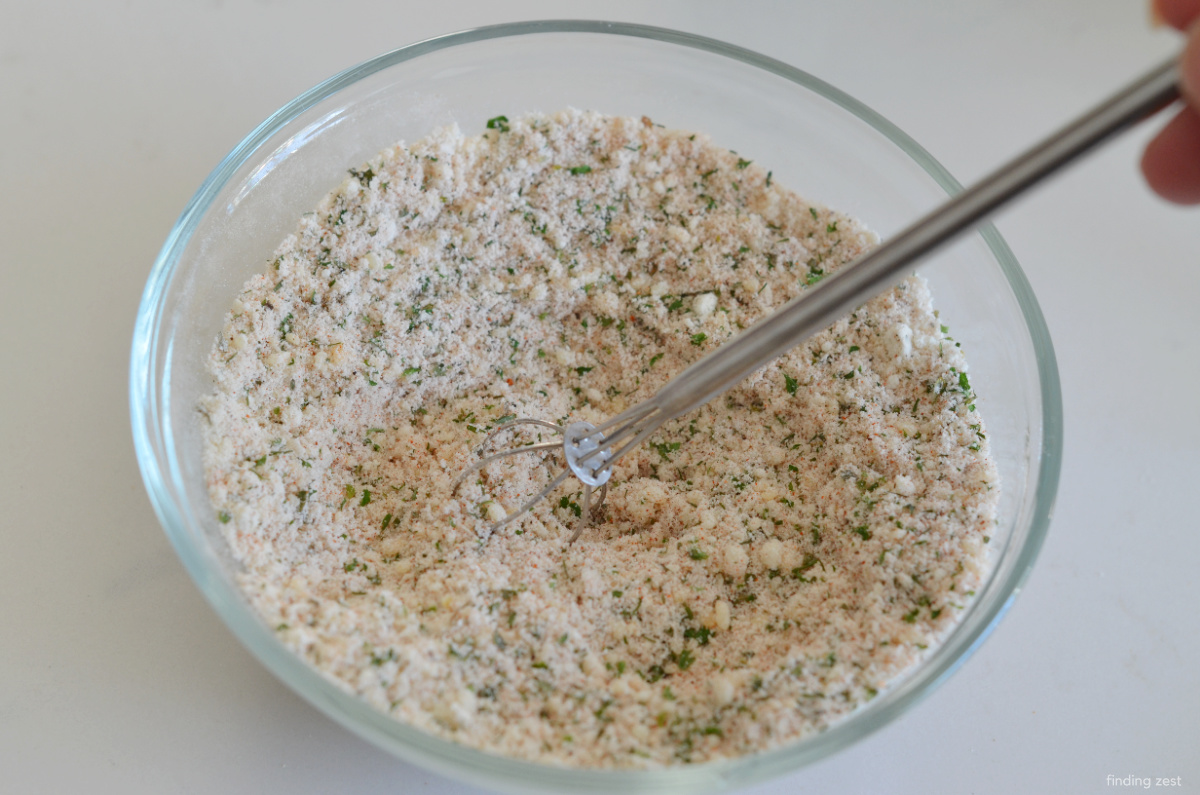 A mix of seasonings for baked ranch pork chops including ranch seasoning mix like Hidden Valley Ranch.