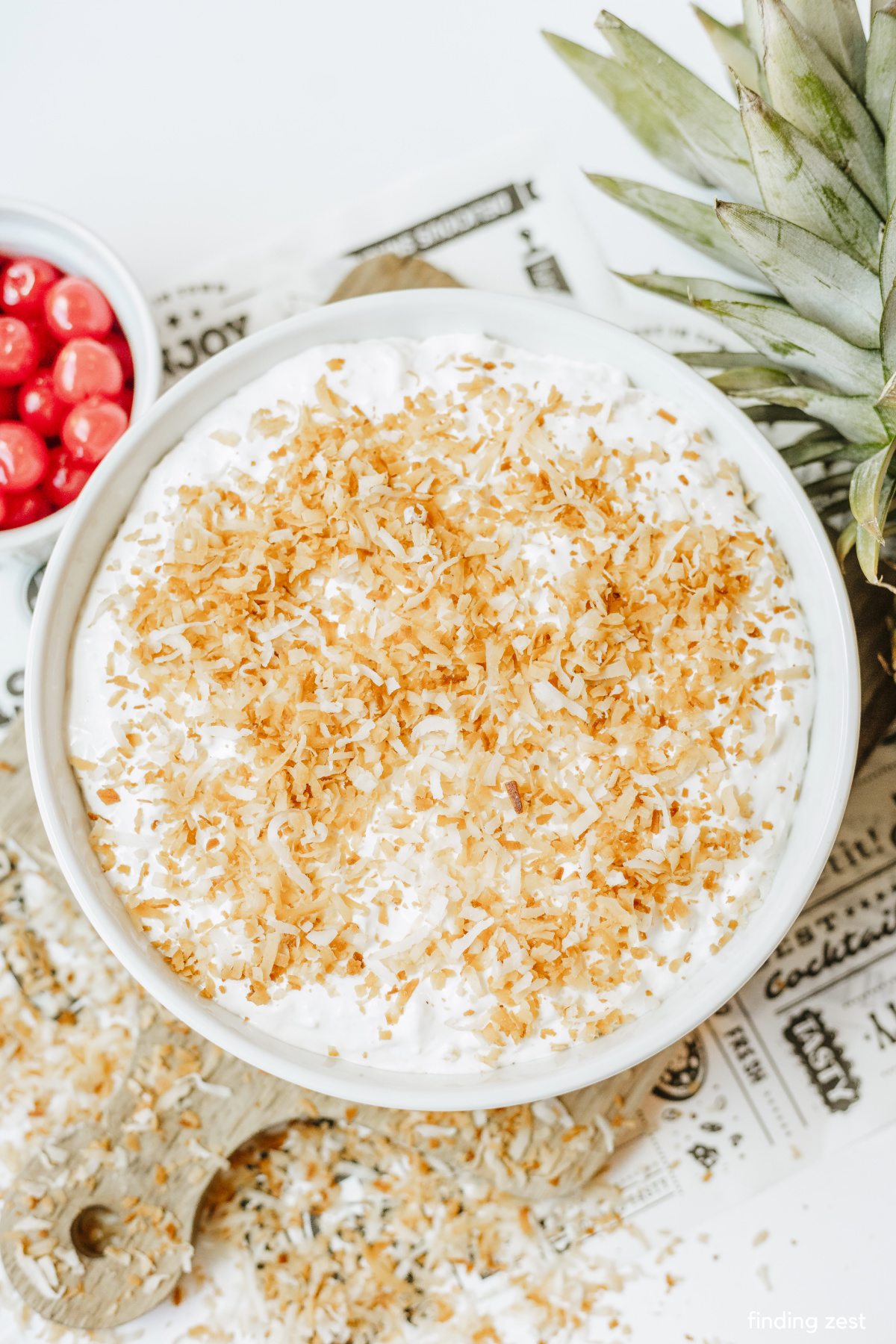 Toasted coconut on top of a pina colada dip really adds so much flavor to this pineapple no bake dessert!